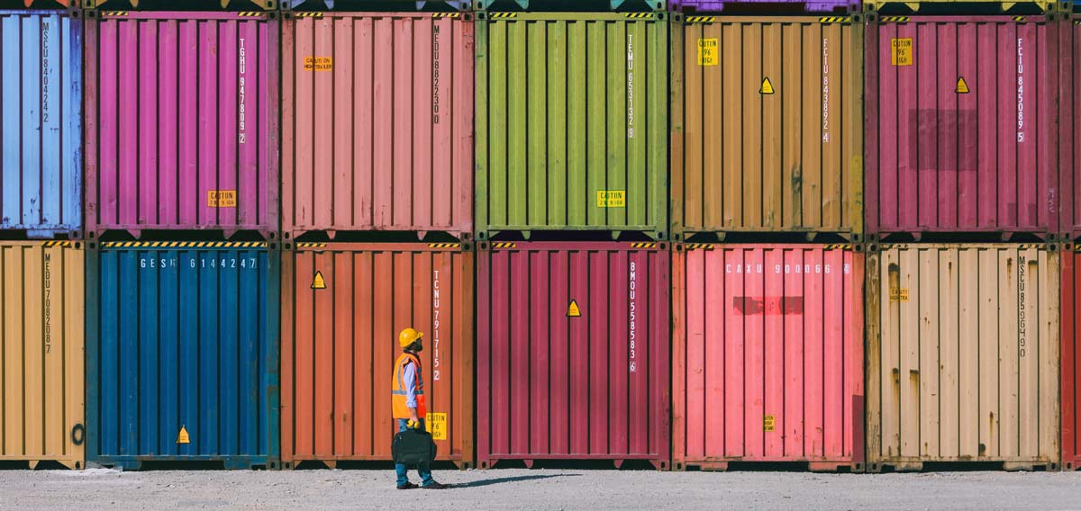business woman leading meeting around conference table