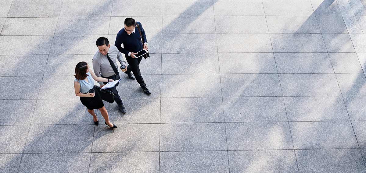 business woman leading meeting around conference table