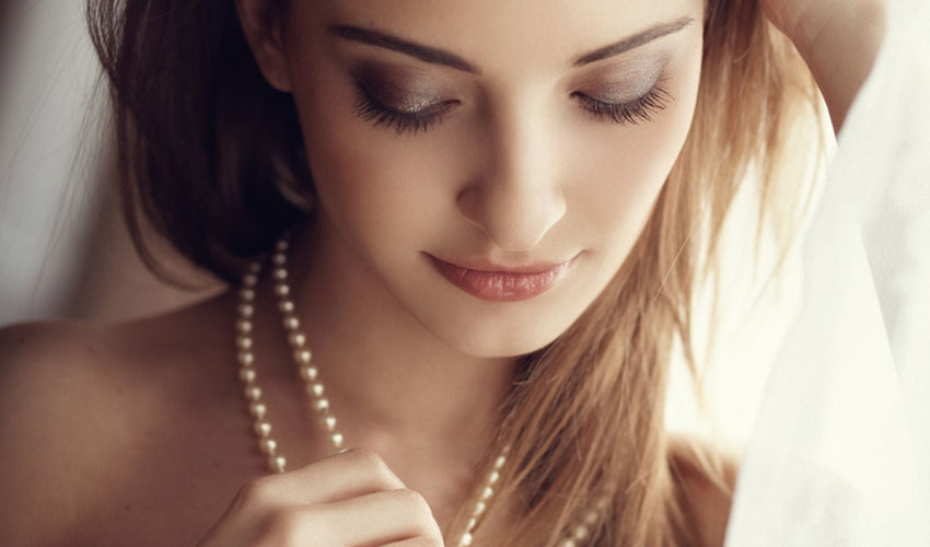 woman wearing pearls